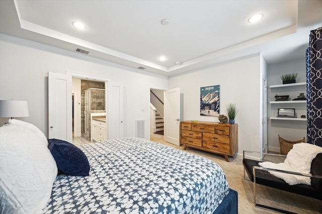 1050 Timbergrove Yards Ln, Houston, TX 77008 - bedroom featuring a tray ceiling, recessed lighting, light colored carpet, and connected bathroom