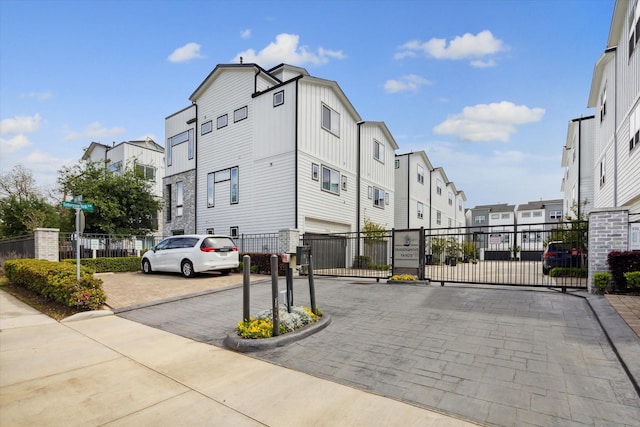 1050 Timbergrove Yards Ln, Houston, TX 77008 - view of street with a residential view, a gated entry, a gate, and curbs