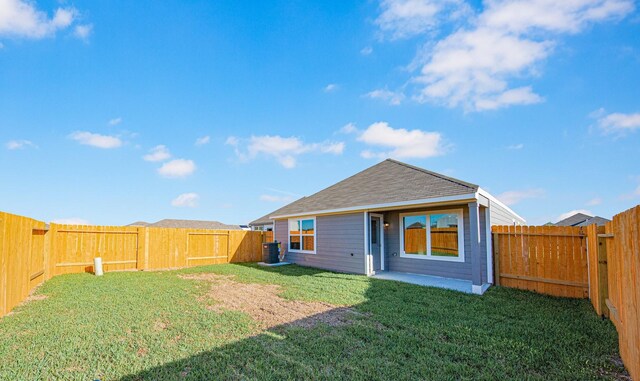 8104 Vanilla Orchid Dr, Houston, TX 77016 - rear view of house with a fenced backyard and a shingled roof
