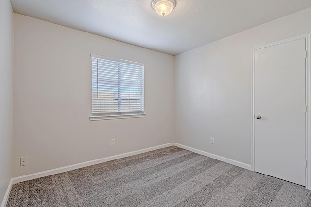 11230 Chelsea Oak St, Houston, TX 77065 - empty room with carpet flooring and baseboards