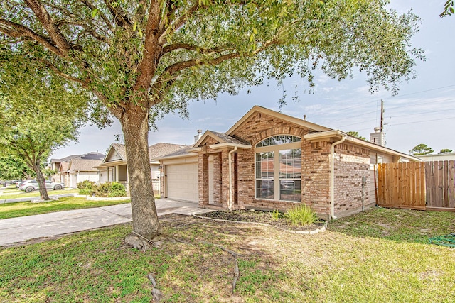 11230 Chelsea Oak St, Houston, TX 77065 - ranch-style home with a garage, brick siding, and driveway