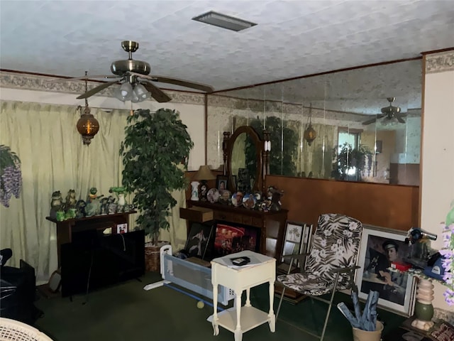 404 Svoboda St, Yoakum, TX 77995 - living area featuring a ceiling fan and a textured ceiling