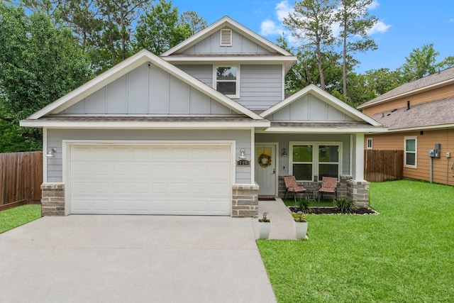 719 Cherokee Dr, Conroe, TX 77316 - view of front of house featuring board and batten siding, covered porch, concrete driveway, and an attached garage