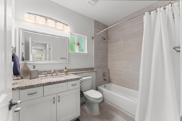 719 Cherokee Dr, Conroe, TX 77316 - full bathroom featuring vanity and shower / bathtub combination with curtain