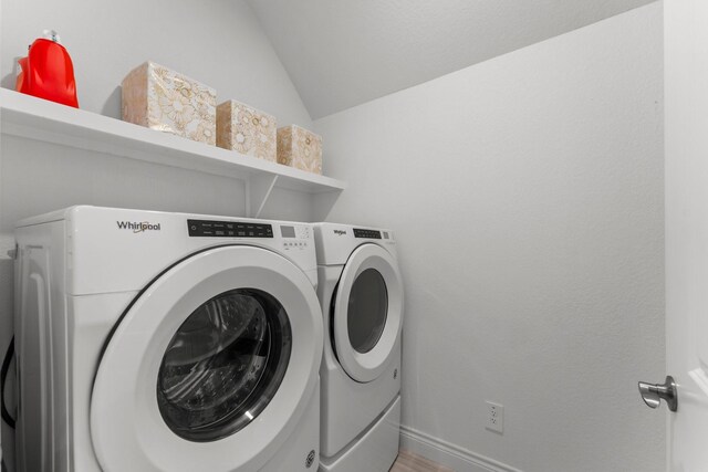 719 Cherokee Dr, Conroe, TX 77316 - laundry area with separate washer and dryer and baseboards
