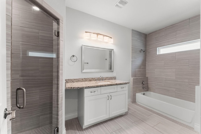 719 Cherokee Dr, Conroe, TX 77316 - full bath with vanity and combined bath / shower with glass door