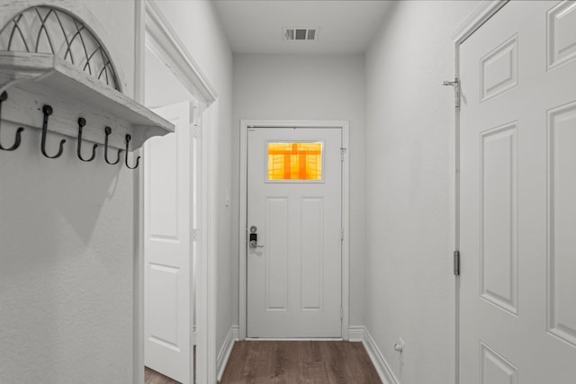 719 Cherokee Dr, Conroe, TX 77316 - entryway featuring dark wood-style floors and baseboards