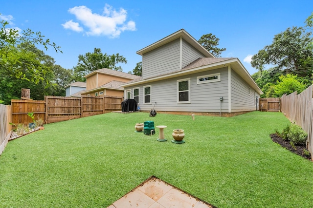 719 Cherokee Dr, Conroe, TX 77316 - rear view of house with a fenced backyard