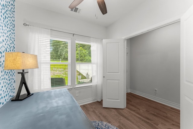 719 Cherokee Dr, Conroe, TX 77316 - unfurnished bedroom featuring wood finished floors and ceiling fan