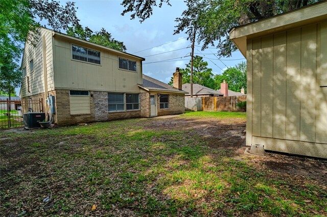 6507 Desert Rose Ln, Houston, TX 77086 - rear view of property with brick siding