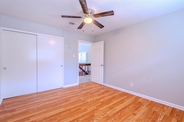 6507 Desert Rose Ln, Houston, TX 77086 - unfurnished bedroom featuring light wood-style floors, a closet, and a ceiling fan