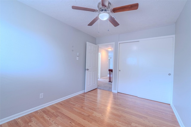 6507 Desert Rose Ln, Houston, TX 77086 - unfurnished bedroom with light wood-style flooring, a closet, and ceiling fan