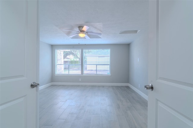 6507 Desert Rose Ln, Houston, TX 77086 - spare room featuring light wood-style floors, a textured ceiling, and ceiling fan