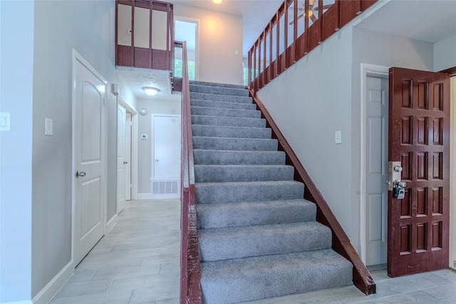 6507 Desert Rose Ln, Houston, TX 77086 - stairway featuring baseboards