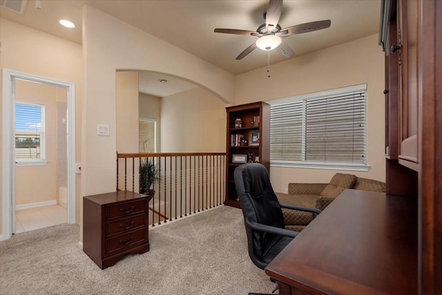1774 Aden Dr, Houston, TX 77003 - office area with ceiling fan, light carpet, and arched walkways
