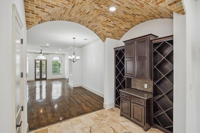 5411 Gibson St, Houston, TX 77007 - wine cellar with brick ceiling, arched walkways, ceiling fan, vaulted ceiling, and a chandelier