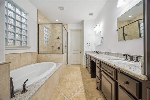 5411 Gibson St, Houston, TX 77007 - full bath with a garden tub, a stall shower, double vanity, and tile patterned floors