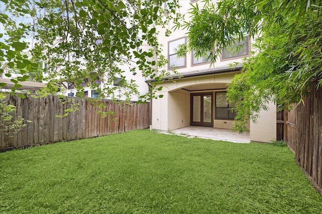 5411 Gibson St, Houston, TX 77007 - fenced backyard featuring french doors and a patio area