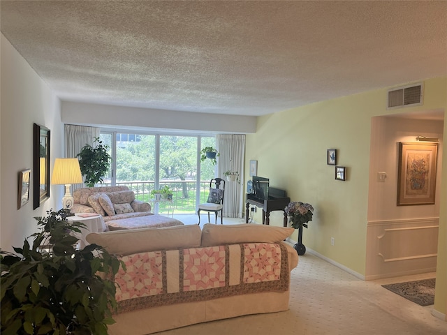 5050 Ambassador Way Unit 201, Houston, TX 77056 - living room with a textured ceiling and baseboards