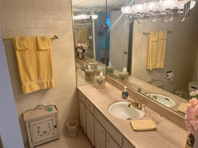 5050 Ambassador Way Unit 201, Houston, TX 77056 - bathroom with tile walls, vanity, and tile patterned floors