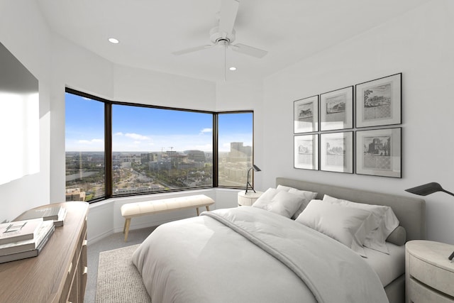 2001 Holcombe Blvd Unit 2305, Houston, TX 77030 - carpeted bedroom featuring multiple windows, recessed lighting, ceiling fan, and a city view