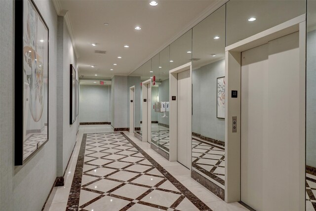 2001 Holcombe Blvd Unit 2305, Houston, TX 77030 - hallway featuring inlaid floor details, recessed lighting, elevator, and ornamental molding