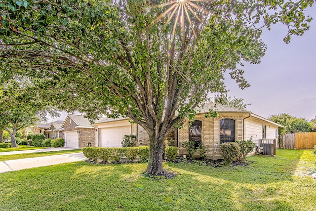 9614 Summer Laurel Ln, Houston, TX 77088 - obstructed view of property featuring brick siding, an attached garage, and driveway