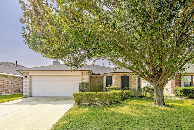 9614 Summer Laurel Ln, Houston, TX 77088 - view of front facade with brick siding, a garage, concrete driveway, and a front lawn