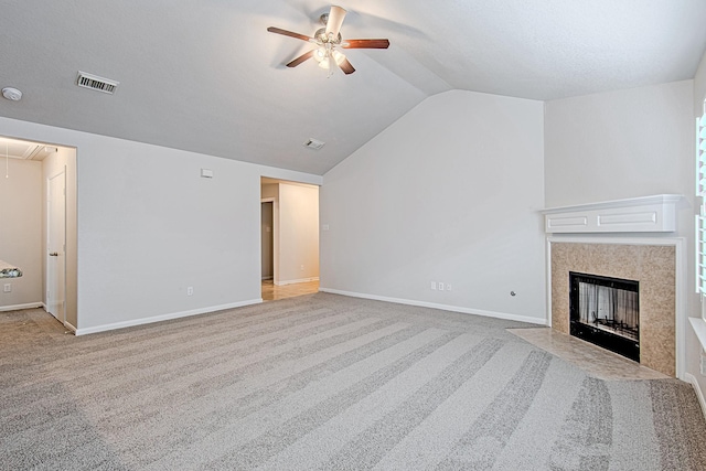 9614 Summer Laurel Ln, Houston, TX 77088 - unfurnished living room featuring attic access, a ceiling fan, lofted ceiling, carpet floors, and a fireplace