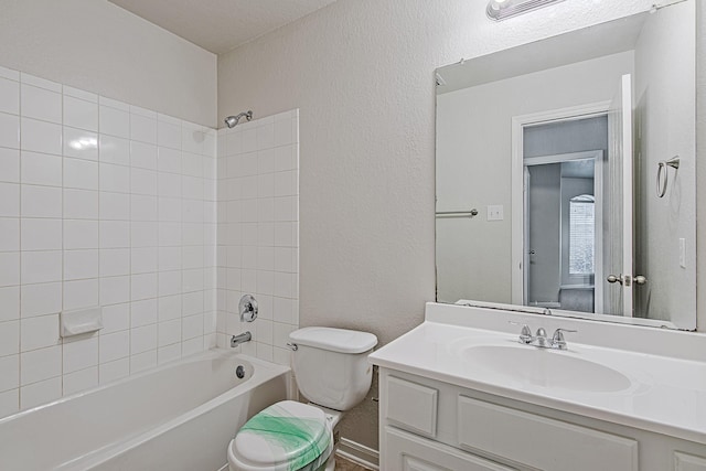 9614 Summer Laurel Ln, Houston, TX 77088 - bathroom with washtub / shower combination, vanity, and a textured wall