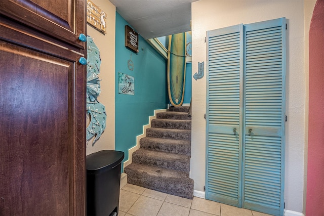 1315 40th St, Rear, Galveston, TX 77550 - staircase featuring tile patterned flooring and baseboards
