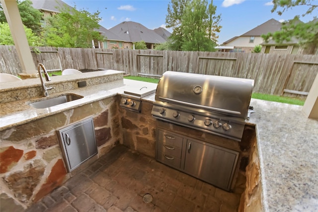 31428 Longwood Park Ln, Spring, TX 77386 - fenced backyard featuring exterior kitchen, a patio, and a residential view