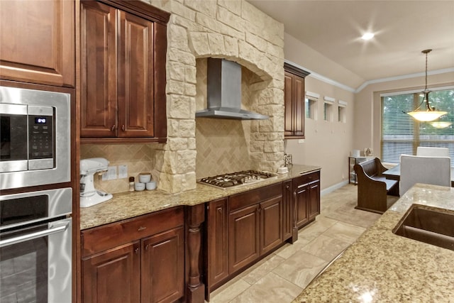 31428 Longwood Park Ln, Spring, TX 77386 - kitchen featuring wall chimney range hood, appliances with stainless steel finishes, ornamental molding, backsplash, and decorative light fixtures