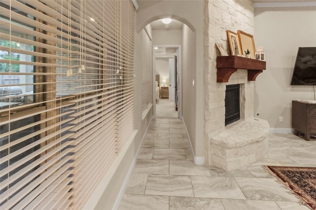 31428 Longwood Park Ln, Spring, TX 77386 - hallway with arched walkways and light marble finish flooring