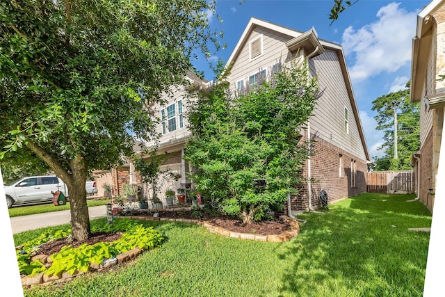 23823 Pennington Hills Dr, Spring, TX 77389 - view of property hidden behind natural elements featuring brick siding