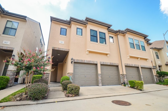 11611 Royal Oaks Vw, Houston, TX 77082 - multi unit property with stucco siding, an attached garage, concrete driveway, and stone siding
