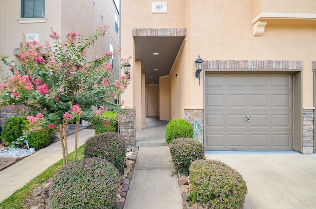 11611 Royal Oaks Vw, Houston, TX 77082 - entrance to property featuring stucco siding, driveway, a garage, and stone siding