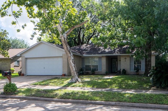 4822 Misty Shadows Dr, Houston, TX 77041 - ranch-style house with brick siding, a garage, driveway, and a front lawn