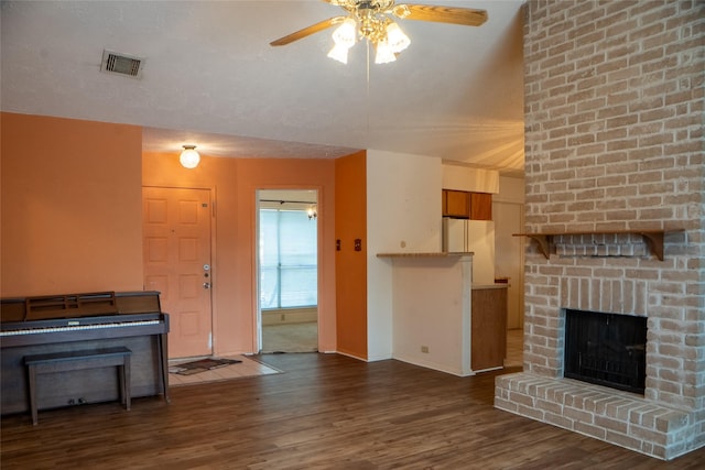 4822 Misty Shadows Dr, Houston, TX 77041 - unfurnished living room with a ceiling fan, wood finished floors, and a brick fireplace
