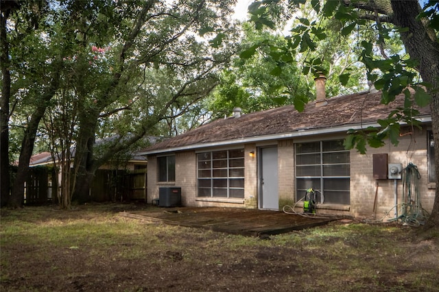 4822 Misty Shadows Dr, Houston, TX 77041 - rear view of property with brick siding, a chimney, and a wooden deck
