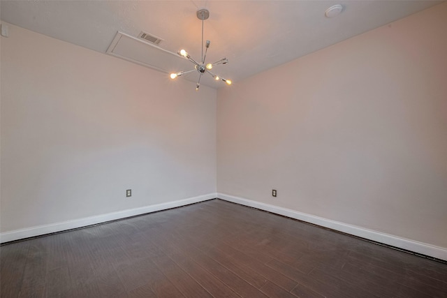 3930 Daphne St, Houston, TX 77021 - unfurnished room with a chandelier, dark wood-style flooring, and a smoke detector