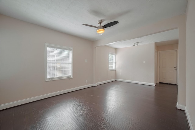 3930 Daphne St, Houston, TX 77021 - spare room with a ceiling fan and dark wood-style flooring