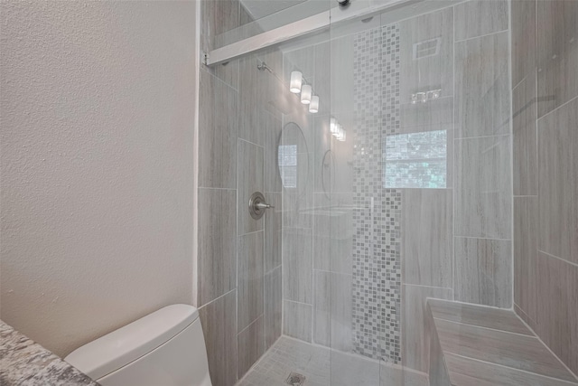 3930 Daphne St, Houston, TX 77021 - full bath with a tile shower and a textured wall
