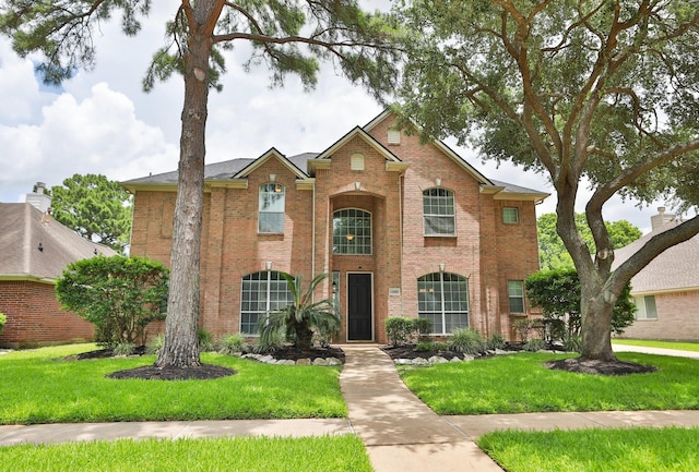 15802 Aberdeen Trails Dr, Houston, TX 77095 - traditional home with brick siding and a front lawn