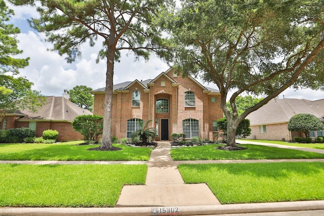 15802 Aberdeen Trails Dr, Houston, TX 77095 - view of front of property with brick siding and a front yard