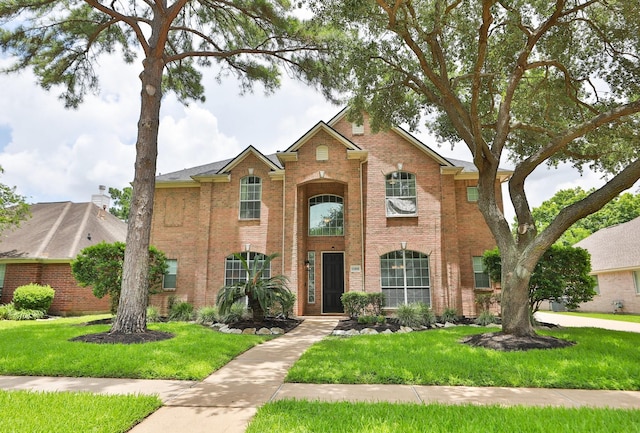 15802 Aberdeen Trails Dr, Houston, TX 77095 - traditional-style home featuring brick siding and a front lawn
