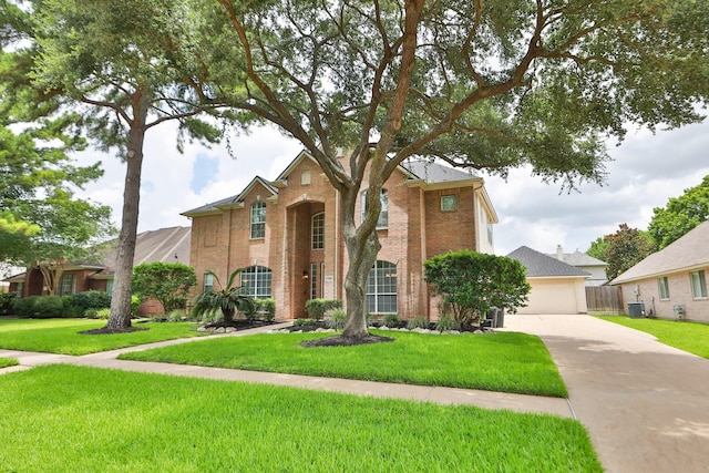15802 Aberdeen Trails Dr, Houston, TX 77095 - traditional home featuring brick siding, a front yard, and a garage