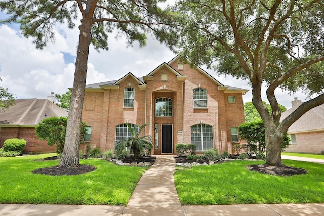 15802 Aberdeen Trails Dr, Houston, TX 77095 - traditional home featuring brick siding and a front lawn