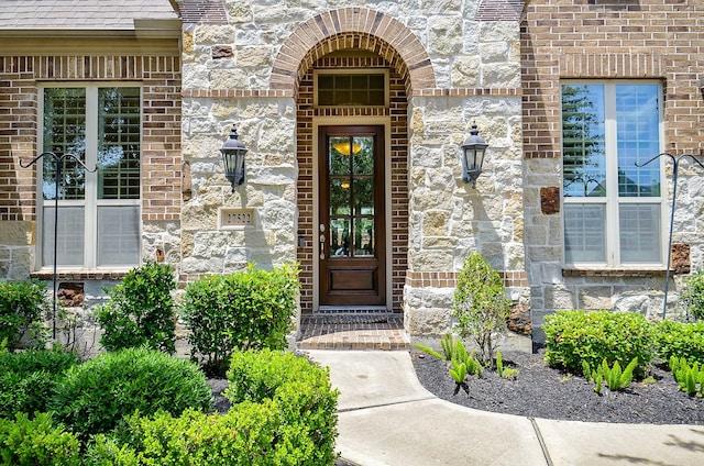 27522 Blackstone Canyon Ln, Katy, TX 77494 - view of exterior entry featuring stone siding and brick siding