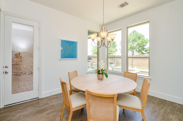 27522 Blackstone Canyon Ln, Katy, TX 77494 - dining area featuring a chandelier and wood finished floors